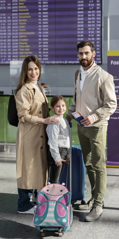 full-shot-smiley-family-with-baggage-min